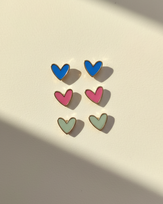 Pairs of resin heart studs in blue, pink and mint with gold rim.