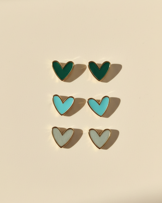 Trio of resin heart stud pairs in green, turquoise and pearly grey with gold rim.