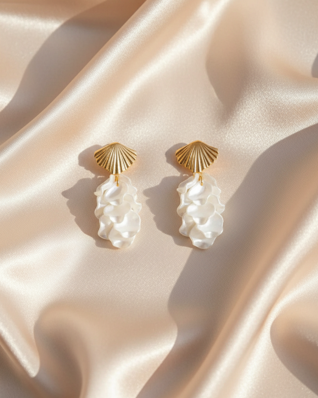 Seafoam Shell Drops’ on satin: gold shell studs with short wavy ivory resin drops.